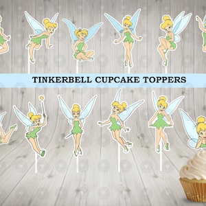 May include: A set of 10 Tinkerbell cupcake toppers featuring the fairy in various poses. The toppers are printed on white cardstock and are ready to be used to decorate cupcakes.