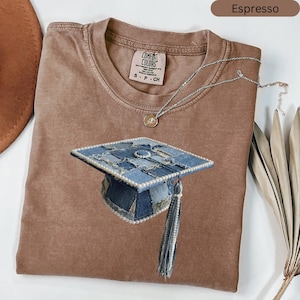 May include: A set of three ceramic mugs with a speckled, matte finish in cream, light grey, and dark grey. Each mug has a simple, minimalist design, ideal for coffee or tea.