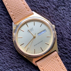 Early 2000s Sharp Quartz Watch. Gold tone. Retro Vintage. New Rubber Strap, Gold Dial. Retro Modernist Design, Day Date, New Battery.