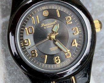 Precision by Gruen Women's Quartz Watch Two Tone Dark Steel and Gold.  Radiant Dial. Barely worn, new battery, runs well. 6.25"