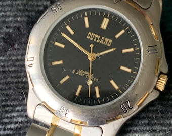 Outland Watch 1990s - Diver Style, Silver tone w/gold tone accents, Black Dial, Good Condition, Good Weight, Works Well. New Battery.