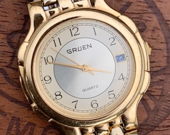 1980s Neo-Vintage Gruen Gold Tone Watch - Champagne Cream Dial with Date - Barely worn, clean, new battery, accurate. Original Integral Band