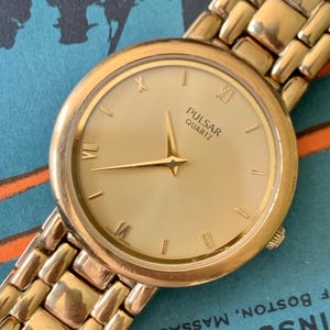 Vintage Pulsar Roman Gold Tone Quartz Watch V700-X018 - Dressy, Formal Goldtone, Gold Dial, Slimline, New Battery. Works. 33.3mm