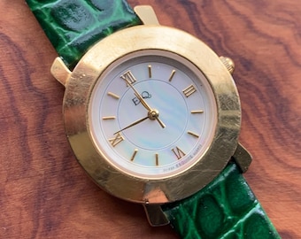 Modernist ESQ (by Movado) Roman Mother of Pearl Dial, Gold Tone Fancy Lugs, 90s, New Crocodile Pattern Green Band. 28mm. Swiss ETA Movement.