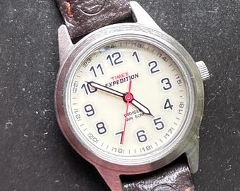 Timex Women's Expedition Indiglo Field Watch – 24 Cream Dial, Black Matte Case, Original Expedition Leather & Nylon Strap. Lightly worn.