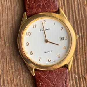 Vintage Pulsar Slim Quartz Watch Y329-6200 - Round with Date, Goldtone, Super Slimline, New Calf Skin Band. New Battery. Works.