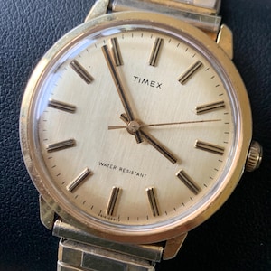 Vintage Timex Marlin Winder Watch, 1977. Radiant Golden Dial with Stick Indices. Very Good Condition Mechanical Winder, works well.