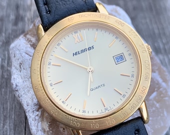 Millennium Era Helbros Quartz Watch Gold Tone Finish, Tachymeter Bezel, Gold Dial with Date New battery. New Black Calf Leather Band.