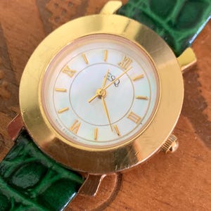 Modernist ESQ (by Movado) Roman Mother of Pearl Dial, Gold Tone Fancy Lugs, 90s, New Crocodile Pattern Green Band. 28mm. Swiss ETA Movement.