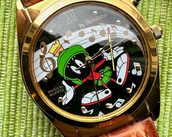 1994 Vintage Looney Tunes Collectible Watch. Armitron Musical Quartz Watch Analog features Marvin the Martian and plays classic Looney Tune!