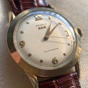 Gold Filled Benrus Three Star Self-winding Automatic Watch. 10K Gold Filled. Good working condition. Nice retro numbers, New Leather Strap.
