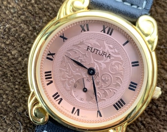 Fancy Lug Futura Quartz Watch - 34mm, Gold Tone w/Copper Embossed Dial. Sub-second hand. Tooled/Stitched Leather Strap. Unworn with Tag!