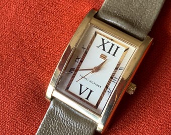 Late 90s Retro-Style Tank Watch: Gold Tone Tommy Hilfiger Tank Watch w/Classic Roman Numerals, Gold Dial. Period  Leather Band, New Battery.