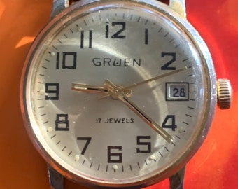 70s Vintage Gruen Winder Watch - 17 Jewels, Gold Tone, Golden Dial & Date in Good Overall Condition - NOS leather strap, runs, keeps time.