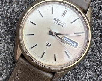 Vintage Seiko 7546-8399 Quartz | 36mm | Patinated Dial | Clear Crystal | New Green & Gold Leather Strap