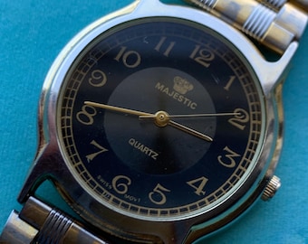 Classic Appearance Black Dial Majestic Watch. 32mm Good used condition. Quartz, New Battery, Two-Tone case and Bracelet. Dial Two-Tone Black