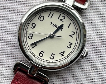 Elegant Timex Women's Watch - Classic Silver Tone Dial w/Decorative Extended Fancy Lugs  Very Good Condition. Original Red Leather Strap.