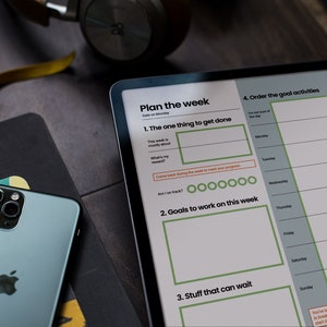 May include: A weekly planner on a tablet screen with the title "Plan the week" and sections for "The one thing to get done", "Goals to work on this week", and "Stuff that can wait".