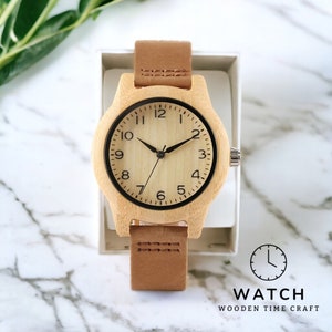 Elegant bamboo wooden ladies bracelet watch with a soft leather band, showcasing a simple yet casual design. Ideal as a gift for women.