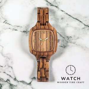 Stylish Zebrawood women watch with a square, analog quartz dial, featuring a natural wooden wristband and a secure push-button hidden clasp, perfect for a chic and eco-friendly accessory.