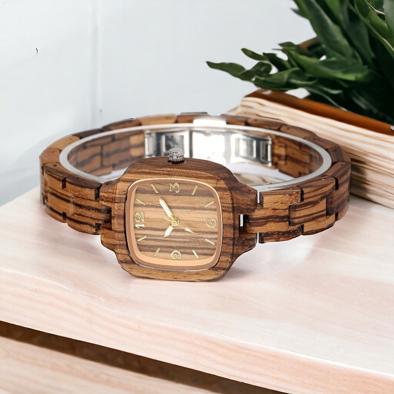 Stylish Zebrawood women watch with a square, analog quartz dial, featuring a natural wooden wristband and a secure push-button hidden clasp, perfect for a chic and eco-friendly accessory.