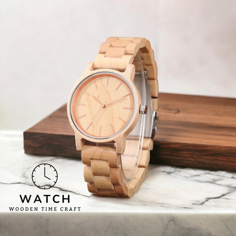 Men wristwatch crafted from Red Wood, Maple, and Ebony, featuring a full wooden case and bangle. Includes a quartz movement and folding clasp for secure wear. Eco-friendly and stylish timepiece for men.