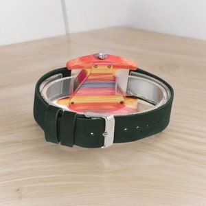 Creative triangular women wooden watch with a colorful dial, accented by green and red genuine leather bands, showcasing elegance and style. Perfect as a top gift choice.