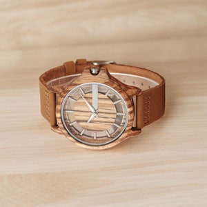 Creative men quartz watch with a transparent hollow dial and a wood case in coffee, brown, or black. Features a genuine leather watchband.