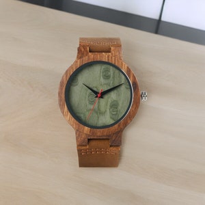 Stylish minimalist wristwatch featuring a wood case with a choice of black, brown, or green dial, complemented by a genuine leather strap. Ideal for both men and women, perfect as a gift.