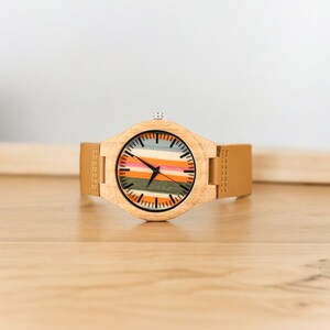 Stylish Fresh Stripes wooden watch with 12-hour display, quartz movement, and a brown genuine leather strap for men. Trendy and eco-friendly timepiece.