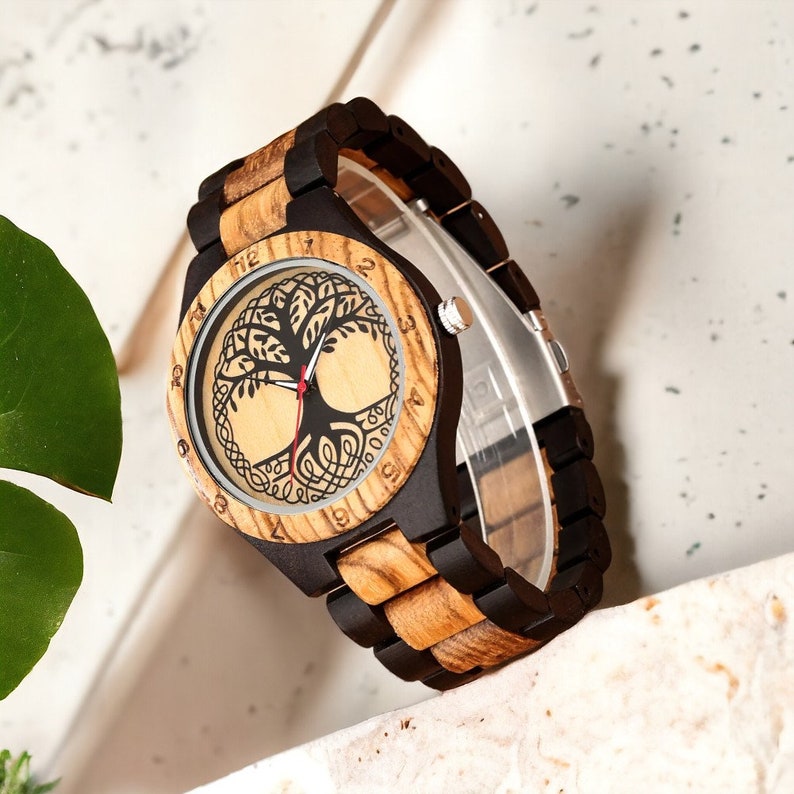 Classic Zebrawood quartz wristwatch for couples featuring a unique life tree pattern on the round dial. Bracelet-style wooden band suitable for both men and women.