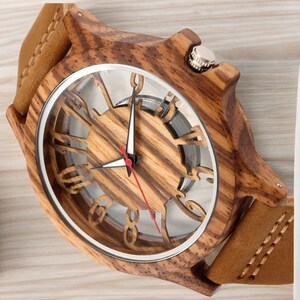 Men chic fashion quartz watch featuring a transparent hollow display with Arabic numerals on a wooden case, complemented by a genuine leather strap.