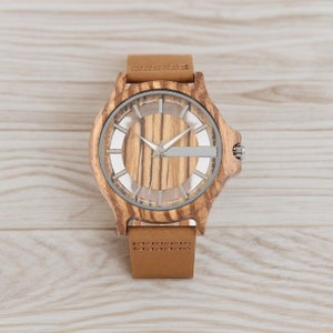 Creative men quartz watch with a transparent hollow dial and a wood case in coffee, brown, or black. Features a genuine leather watchband.