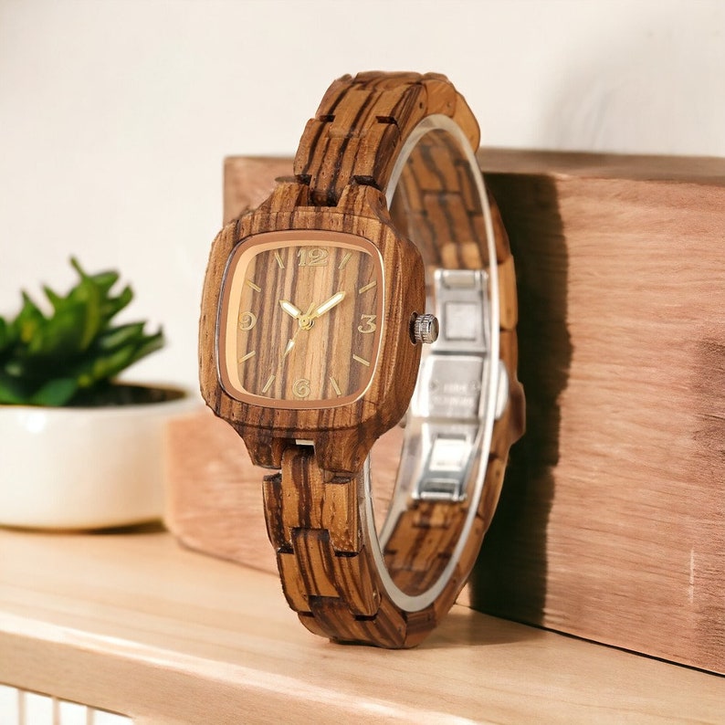 Stylish Zebrawood women watch with a square, analog quartz dial, featuring a natural wooden wristband and a secure push-button hidden clasp, perfect for a chic and eco-friendly accessory.