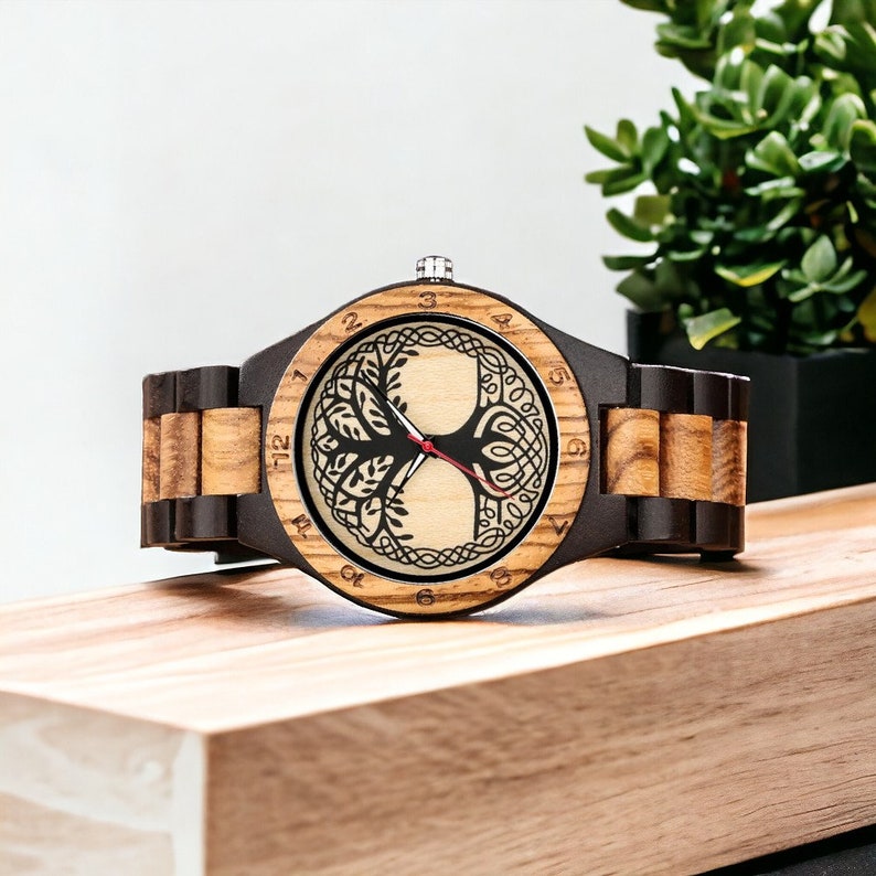 Classic Zebrawood quartz wristwatch for couples featuring a unique life tree pattern on the round dial. Bracelet-style wooden band suitable for both men and women.