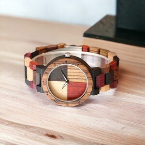 Stylish unisex quartz wristwatch featuring a colorful wood pattern dial and a matching natural wooden bangle band. Ideal for couples. Eco-friendly and fashionable.