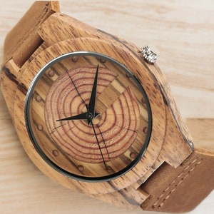 Men quartz wristwatch with a unique wooden design, showcasing annual rings and block points on the face, paired with black hands. Features a brown genuine leather strap and is ideal for sports and casual wear.