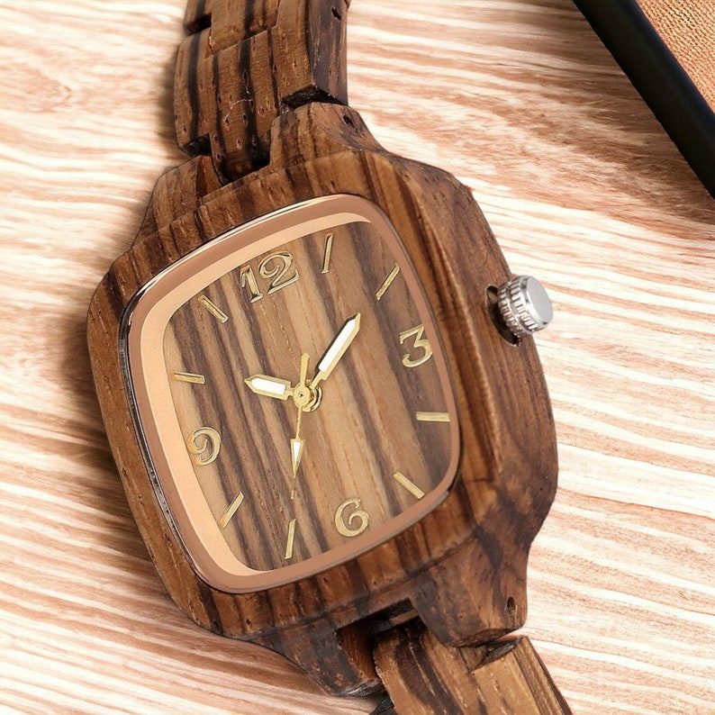 Stylish Zebrawood women watch with a square, analog quartz dial, featuring a natural wooden wristband and a secure push-button hidden clasp, perfect for a chic and eco-friendly accessory.