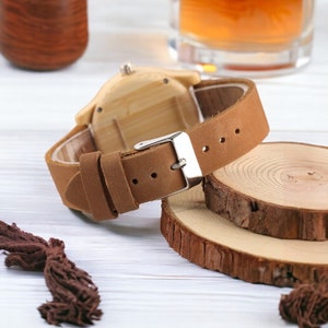 Elegant bamboo wooden ladies bracelet watch with a soft leather band, showcasing a simple yet casual design. Ideal as a gift for women.