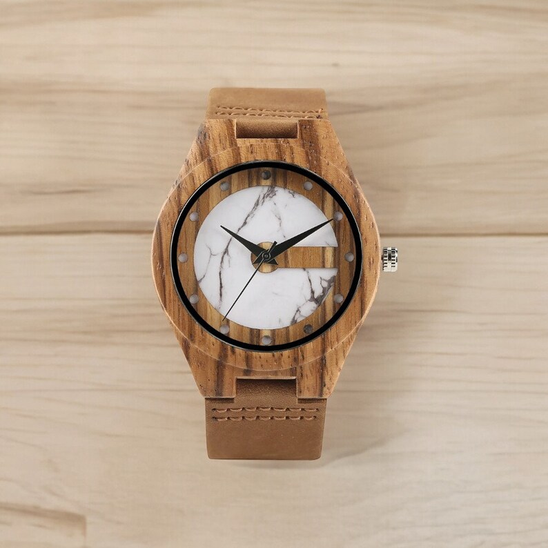 Stylish men wristwatch featuring a unique white and green display, set in zebrawood casing with a quartz movement. Paired with a brown genuine leather strap, this casual yet fashionable accessory complements any outfit.