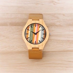 Stylish Fresh Stripes wooden watch with 12-hour display, quartz movement, and a brown genuine leather strap for men. Trendy and eco-friendly timepiece.