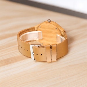 Stylish Fresh Stripes wooden watch with 12-hour display, quartz movement, and a brown genuine leather strap for men. Trendy and eco-friendly timepiece.