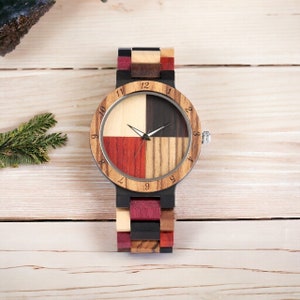 Stylish unisex quartz wristwatch featuring a colorful wood pattern dial and a matching natural wooden bangle band. Ideal for couples. Eco-friendly and fashionable.