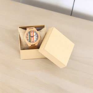 Stylish Fresh Stripes wooden watch with 12-hour display, quartz movement, and a brown genuine leather strap for men. Trendy and eco-friendly timepiece.