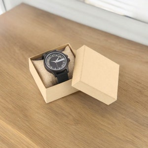 Creative men quartz watch with a transparent hollow dial and a wood case in coffee, brown, or black. Features a genuine leather watchband.