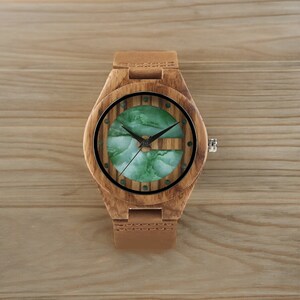 Stylish men wristwatch featuring a unique white and green display, set in zebrawood casing with a quartz movement. Paired with a brown genuine leather strap, this casual yet fashionable accessory complements any outfit.