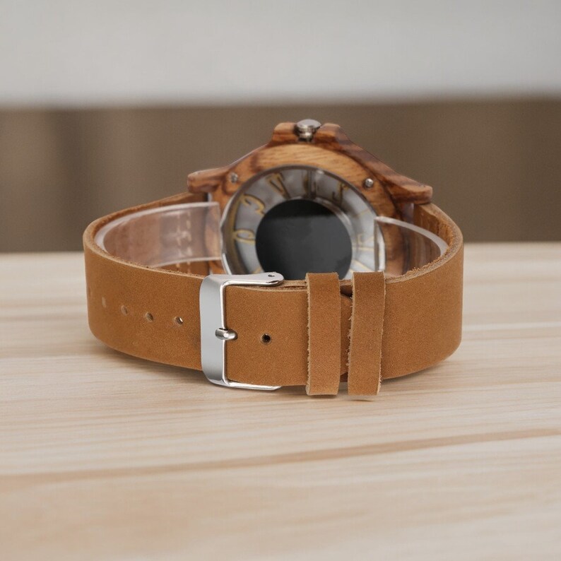 Men chic fashion quartz watch featuring a transparent hollow display with Arabic numerals on a wooden case, complemented by a genuine leather strap.