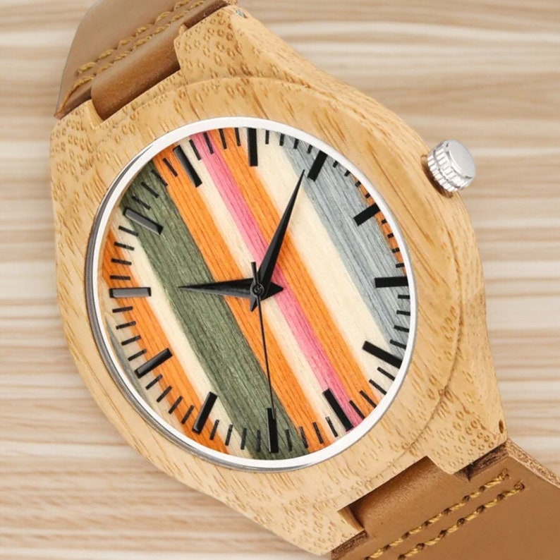 Stylish Fresh Stripes wooden watch with 12-hour display, quartz movement, and a brown genuine leather strap for men. Trendy and eco-friendly timepiece.