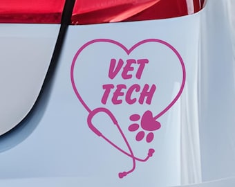 May include: A pink vinyl decal applied to the rear bumper of a white vehicle. The design features a heart outline containing the text VET TECH, with a stethoscope forming the bottom of the heart and a small paw print integrated into the right side.