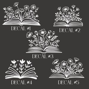 May include: Five white floral book decals on a dark gray background. Each decal features an open book with flowers and foliage emerging from the pages. The text "DECAL #" followed by a number is below each design.